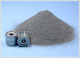 Sintered oil impregnated bearing material for fan motor having low cost and long life
